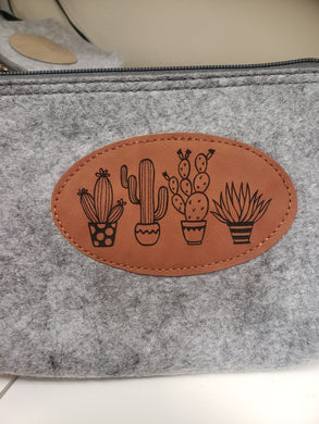 Grey felt zipper bag with cactus themed engraving